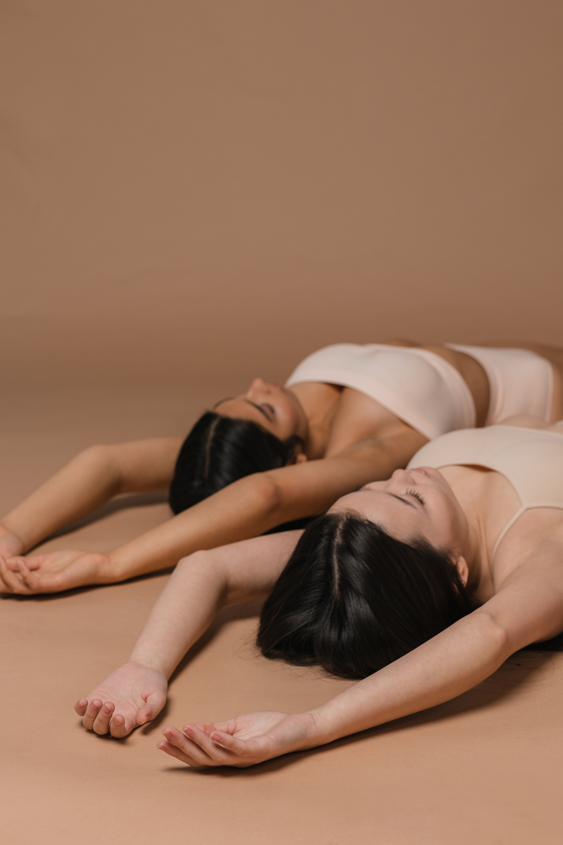 Women in Nude Underwear Lying on the Floor